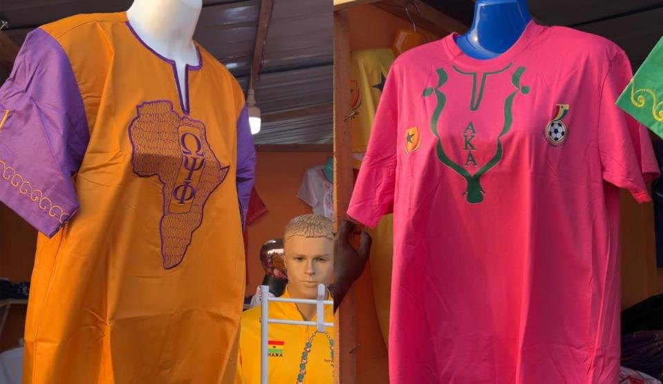 A collage of two photos of shirts on sale at the 2022 Afrochella Festival in Ghana last month. Clothing representing the Divine Nine fraternities and sororities stood out at this booth. (theGrio Photo/Chinekwu Osakwe)