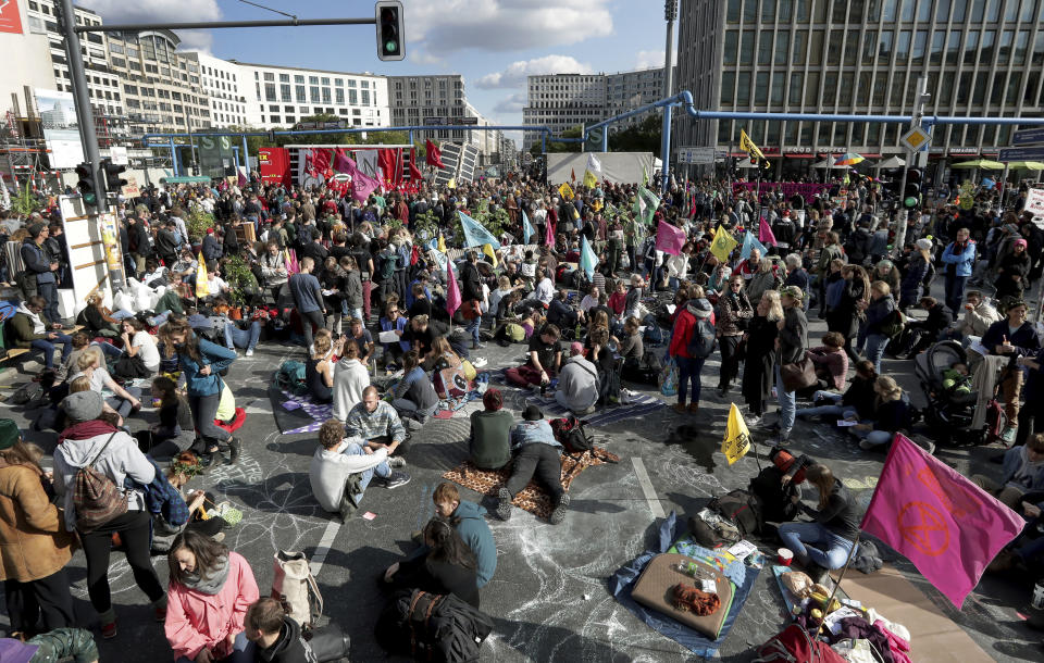 Supporters of the 'Extinction Rebellion' movement block a road at the Potsdamer Platz square in Berlin, Germany, Oct. 7, 2019. (Photo: Michael Sohn/AP)