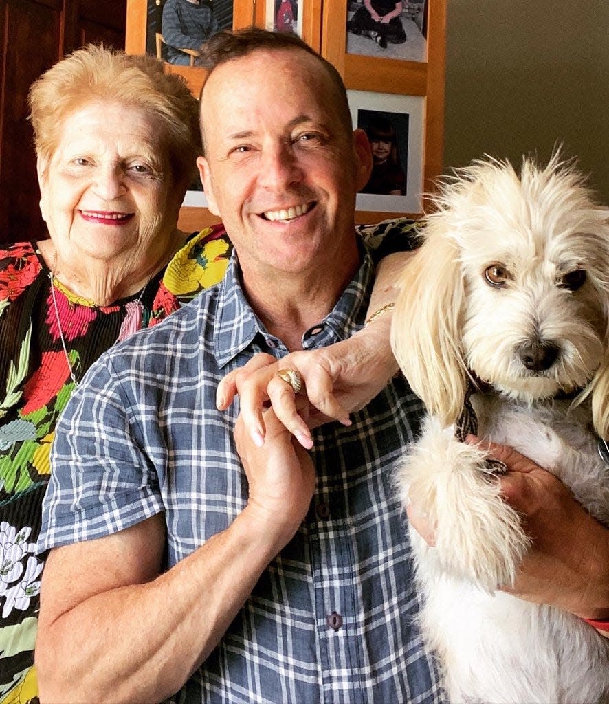 Andy Corren and his mother, Renay Mandel Corren, and her dog Hudson are seen in this family photo.