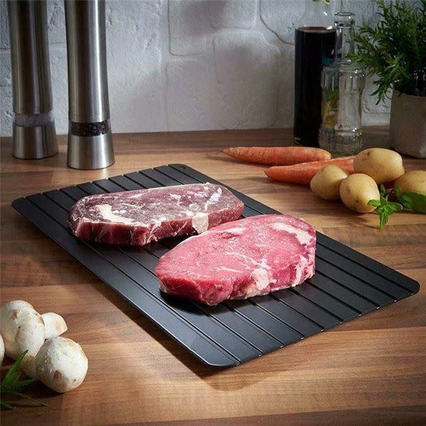 <p><a href="https://go.redirectingat.com?id=74968X1596630&url=https%3A%2F%2Fwww.walmart.com%2Fip%2FFast-Defrosting-Tray-Natural-Thawing-Frozen-Meat-Rapid-Plate-Board-Meat-Food-Mat-Thaw-Quickly-Eco-friendly-No-Electricity-Chemicals-Microwave%2F389208387&sref=https%3A%2F%2Fwww.redbookmag.com%2Ffood-recipes%2Fentertaining%2Fg60961664%2Ffathers-day-grilling-gift1%2F" rel="nofollow noopener" target="_blank" data-ylk="slk:Shop Now;elm:context_link;itc:0;sec:content-canvas" class="link ">Shop Now</a></p><p>Artrylin Fast Defrosting Tray</p><p>walmart.com</p><p>$29.97</p><span class="copyright">Artrylin </span>