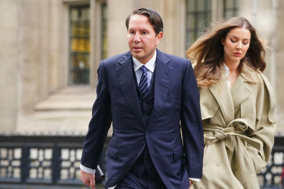 James Stunt arrives with partner Helena Robinson at the Rolls Building in London (Victoria Jones/PA) (PA Wire)