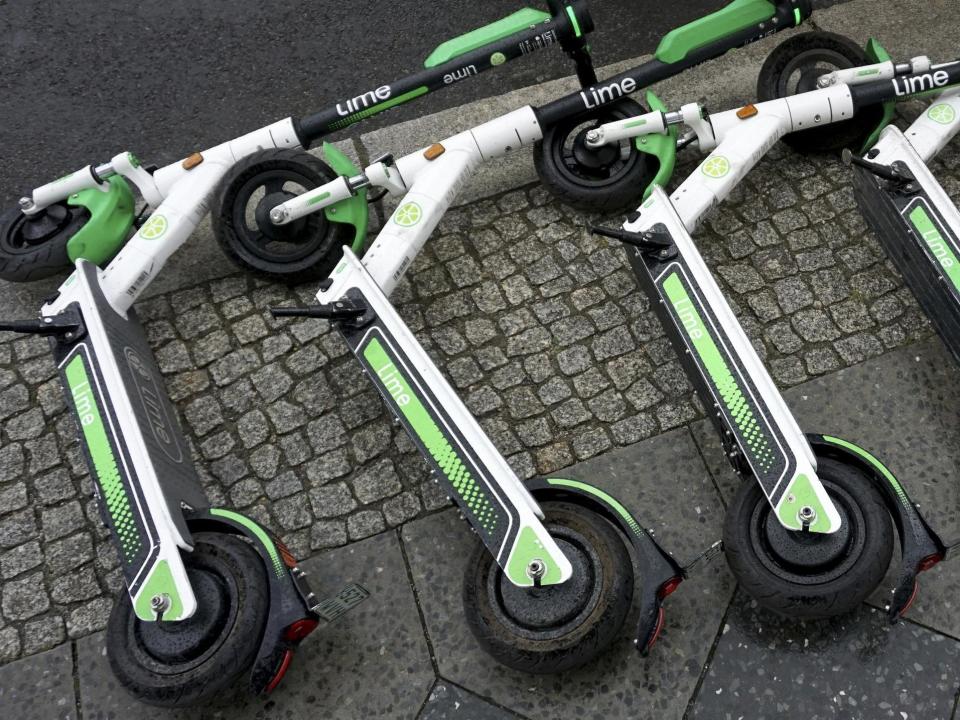 Rental e-scooters lie on a pavement in Berlin, Germany (file image): AP/Michael Sohn