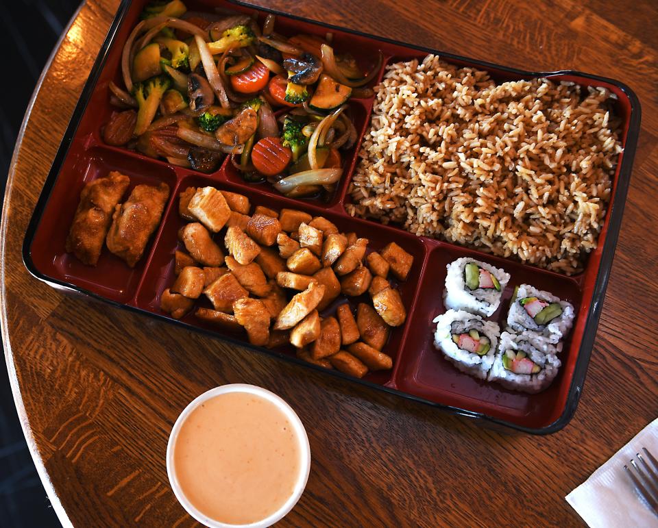 Konnichiwa is a new Japanese restaurant in downtown Spartanburg. This is a Chicken Bento Box: 4 California rolls, 2 pork gyozas, grilled chicken and mixed veggies. 