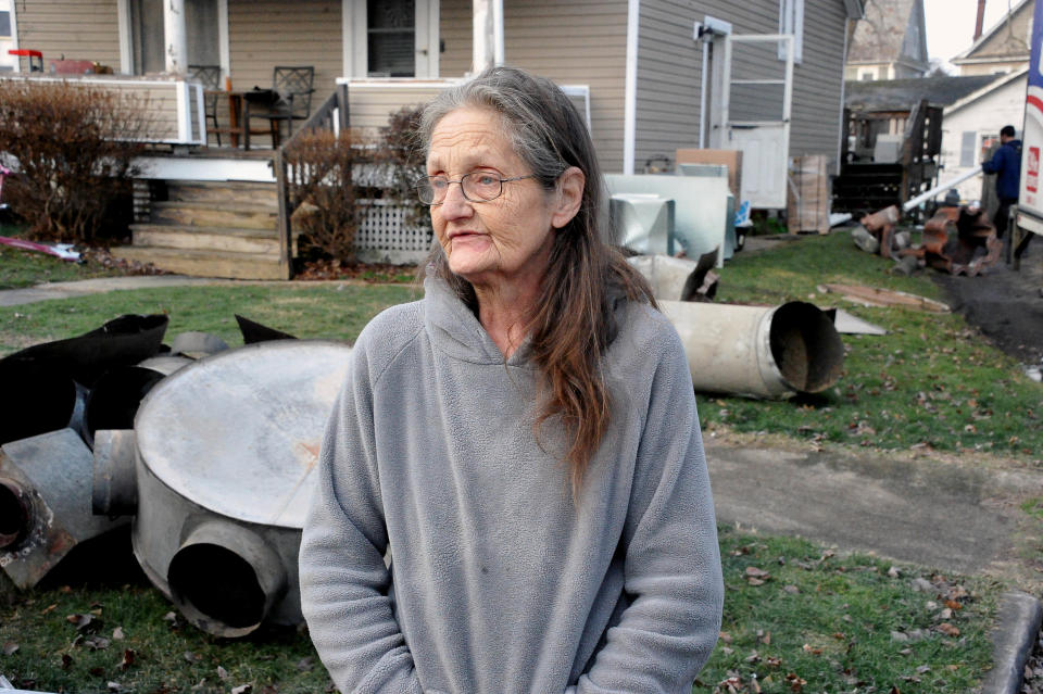 Surrounded by parts of her old furnace, dated back to 1906, Brenda Deeter talks about how it broke down about two years ago and not being able to afford a new one.