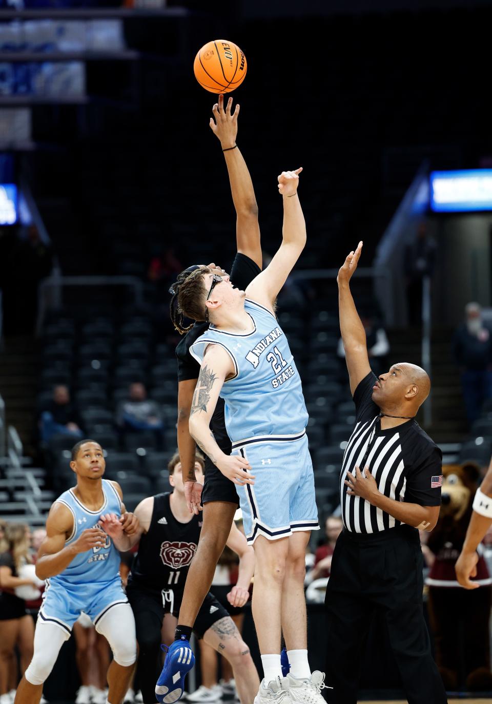 Missouri State sophomore N.J. Benson (35) and Indiana State sophomore Robbie Avila (21) reach for the tipoff during a Missouri Valley Conference Tournament game between Missouri State and Indiana State, Friday, March 8, 2024, at Enterprise Center in St. Louis.