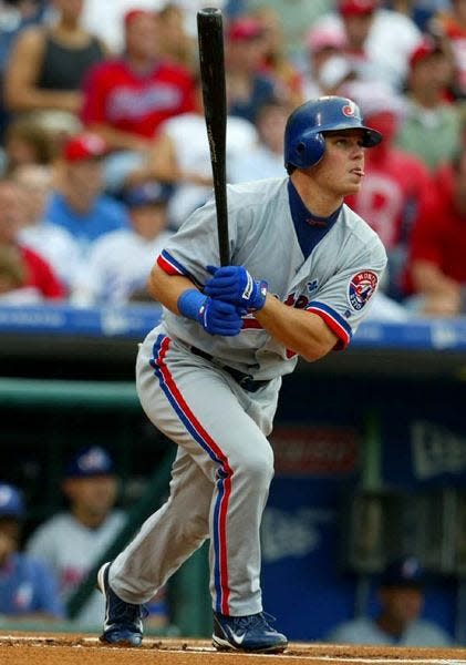 Montreal Expos outfielder Brad Wilkerson hits a lead-off first-inning home run in Philadelphia, one of his three on the season.