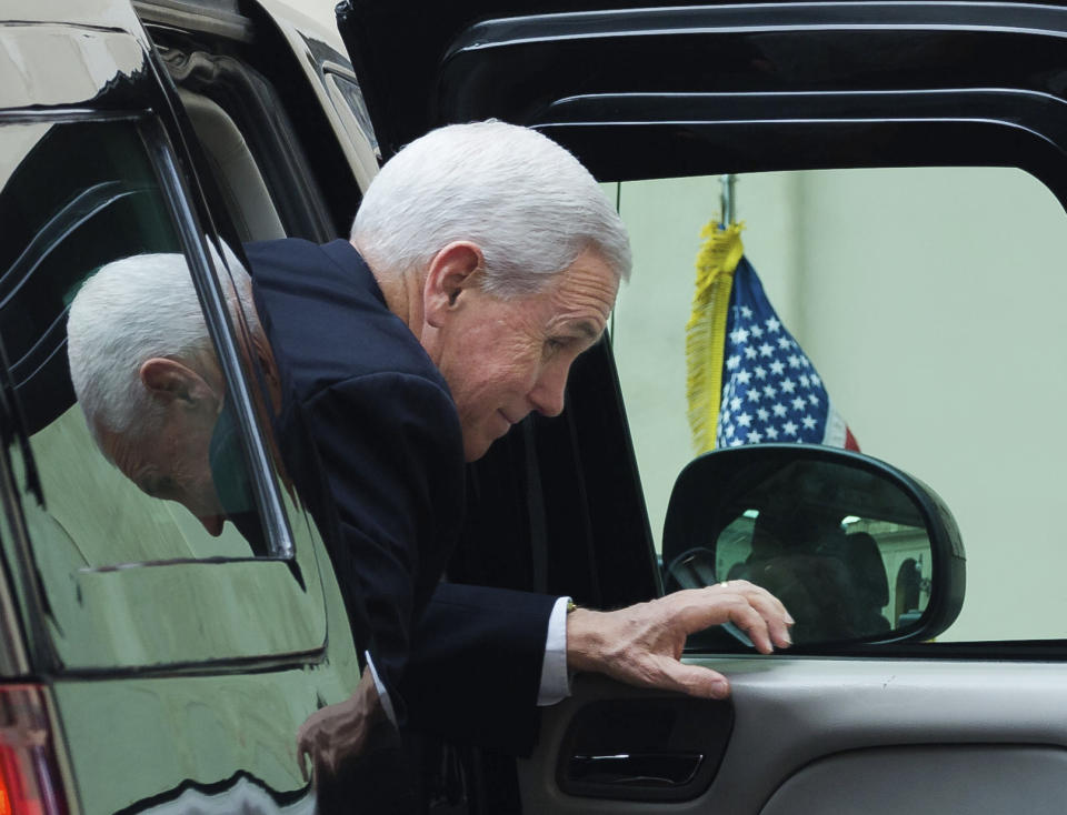 US Vice President Mike Pence steps out of a car as he arrives at the San Damaso courtyard at the Vatican ahead of his private audience with Pope Francis, Friday, Jan. 24, 2020. (AP Photo/Domenico Stinellis)