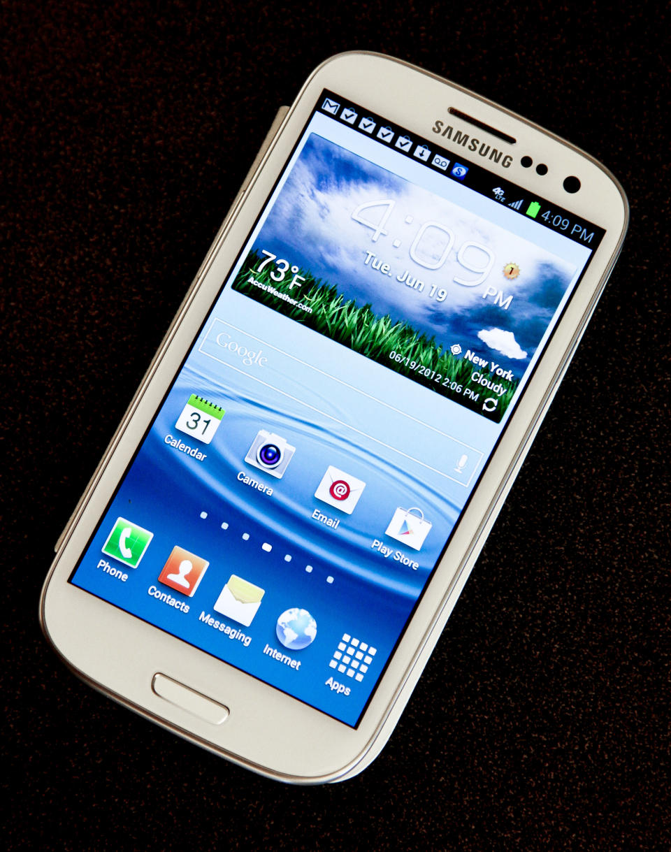 This June 19, 2012 photo shows Samsung’s new Galaxy S III phone, in New York. The Galaxy S III, which looks and feels like an oversized iPhone, is available next week. (AP Photo/Bebeto Matthews)