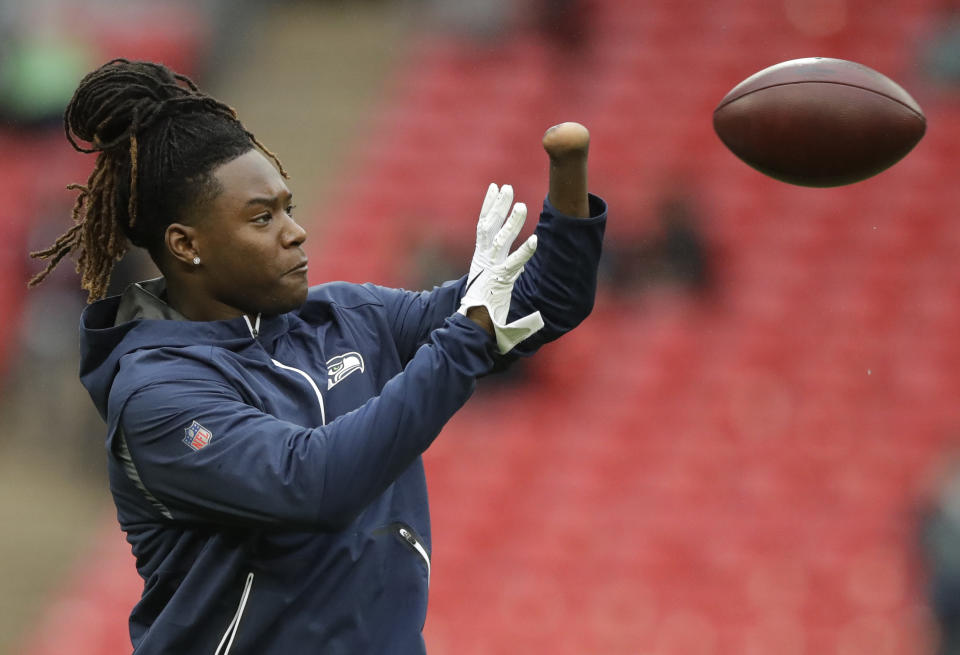 Seattle Seahawks linebacker Shaquem Griffin (49) catches the ball during the warm-up before an NFL football game against Oakland Raiders at Wembley stadium in London, Sunday, Oct. 14, 2018. (AP Photo/Matt Dunham)