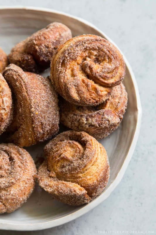 <p>The Little Epicurean</p><p>Cinnamon rolls meets croissant with these flakey, cinnamon-sugar-filled buns.</p><p><strong><br> Get the recipe:</strong> <a href="https://www.thelittleepicurean.com/morning-buns/" rel="nofollow noopener" target="_blank" data-ylk="slk:Morning Buns;elm:context_link;itc:0;sec:content-canvas" class="link rapid-noclick-resp">Morning Buns</a></p>