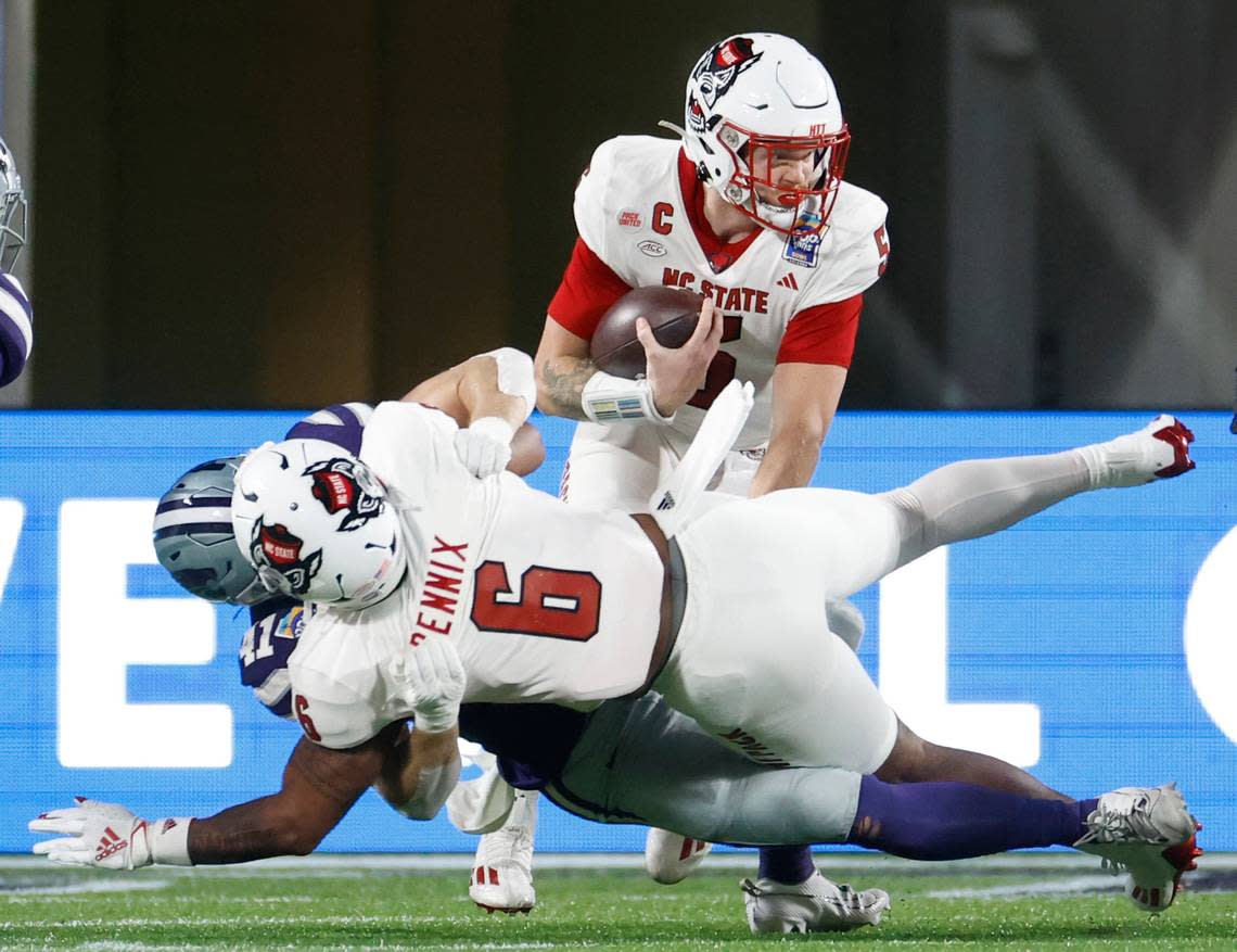 N.C. State quarterback Brennan Armstrong (5) looks for running room during the first half of N.C. State’s game against Kansas State in the Pop-Tarts Bowl at Camping World Stadium in Orlando, Fla., Thursday, Dec. 28, 2023. Ethan Hyman/ehyman@newsobserver.com