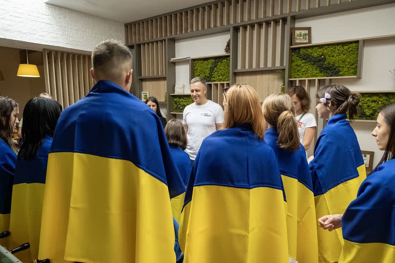 Mykola Kuleba, founder of Save Ukraine, with children who have been returned to Ukraine.