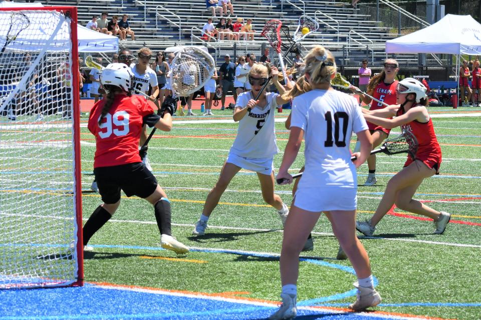 Morristown sophomore Megan O'Brien shoots on Lenape  junior goalie Paige Shaw at the 2022 NJSIAA Group 4 girls lacrosse championship at Warren Hills High School