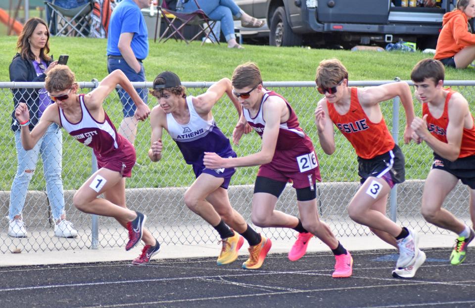 The runners race out of the start of the 1600 meter run on Friday. Pictured are the winner Ben Gautsche of Union City (far left), runner-up Ethan O'Connor of Athens, and third place finisher Cohen Burdick of Union City