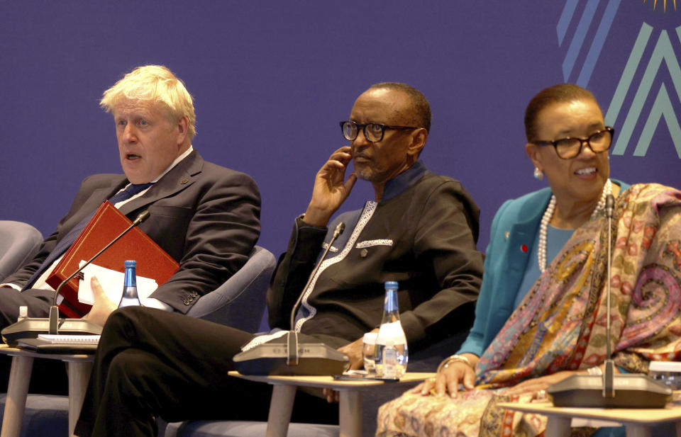 Britain's Prime Minister Boris Johnson, Rwanda President Paul Kagame and Secretary-General of the Commonwealth of Nations Patricia Scotland during the Leaders' Retreat executive session on the sidelines of the 2022 Commonwealth heads of Government meeting in Kigali, Rwanda, Saturday June 25, 2022. (Dan Kitwood/Pool via AP)