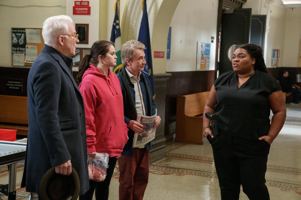 Charles (Steve Martin), Mabel (Selena Gomez), Oliver (Martin Short), with Detective Williams (Da'Vine Joy Randolph), are questioned in the murder of their apartment building's board president.