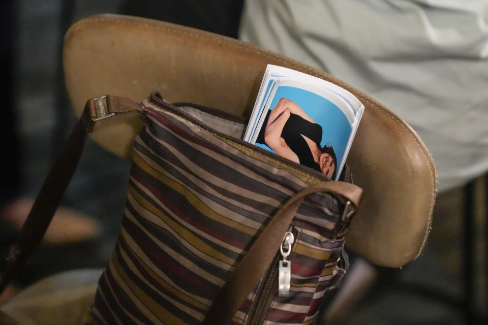 Stickers of Independent candidate for the inner city seat of Wentworth, Allegra Spender, sit in a bag at a public forum ahead of next weekend's general election in Sydney, Australia on May 16, 2022. Australia's government, considered a laggard on combating climate change, faces a new threat in the form of highly-organized and well-funded independent election candidates who demand deeper cuts on greenhouse gas emissions. (AP Photo/Mark Baker)