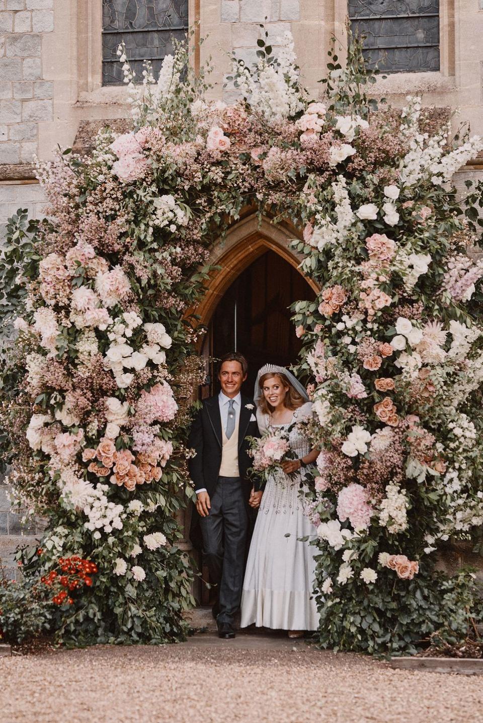 <p>The couple tied the knot with an intimate wedding ceremony at the <a href="https://www.townandcountrymag.com/society/tradition/a33348976/princess-beatrice-edoardo-mapelli-mozzi-wedding-venue-royal-chapel-all-saints/" rel="nofollow noopener" target="_blank" data-ylk="slk:Royal Chapel of All Saints;elm:context_link;itc:0;sec:content-canvas" class="link ">Royal Chapel of All Saints</a> at Royal Lodge, after the coronavirus pandemic put their original wedding plans on pause. The royal wedding was said to have had a <a href="https://www.townandcountrymag.com/society/tradition/a33356019/princess-beatrices-royal-wedding-secret-garden-theme/" rel="nofollow noopener" target="_blank" data-ylk="slk:“secret garden” theme;elm:context_link;itc:0;sec:content-canvas" class="link ">“secret garden” theme</a>. Princess Beatrice wore Queen Mary’s diamond fringe tiara and<a href="https://www.townandcountrymag.com/society/tradition/a31085338/princess-beatrice-wedding-dress/" rel="nofollow noopener" target="_blank" data-ylk="slk:a vintage wedding dress by famed fashion designer Norman Hartness;elm:context_link;itc:0;sec:content-canvas" class="link "> a vintage wedding dress by famed fashion designer Norman Hartness</a>, both of which were on loan to her by the Queen.</p>