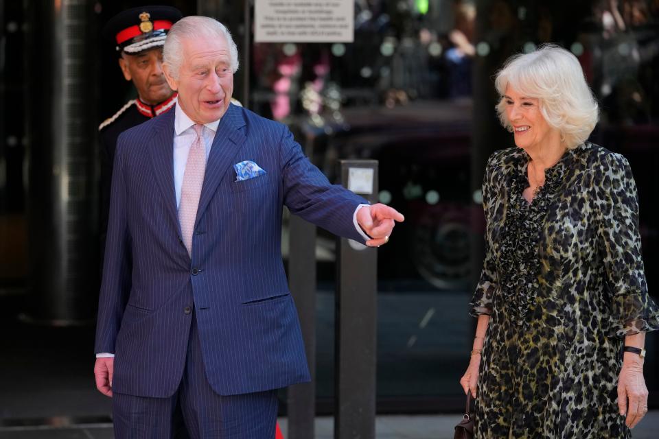 It was all smiles from Charles and Camilla as he returned to work (AP)