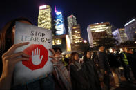 A protester holds a sign reading "Stop Tear Gas" during a rally against the police's use of tear gas in Hong Kong, Friday, Dec. 6, 2019. Hong Kong police have fired more than 10,000 tear gas canisters to quell violent protests that have rocked the city for six months. Its heavy and prolonged use in Hong Kong — one of the world's most densely populated cities and known for its concrete jungle of high-rises — is unusual and has sparked health fears. (AP Photo/Vincent Thian)
