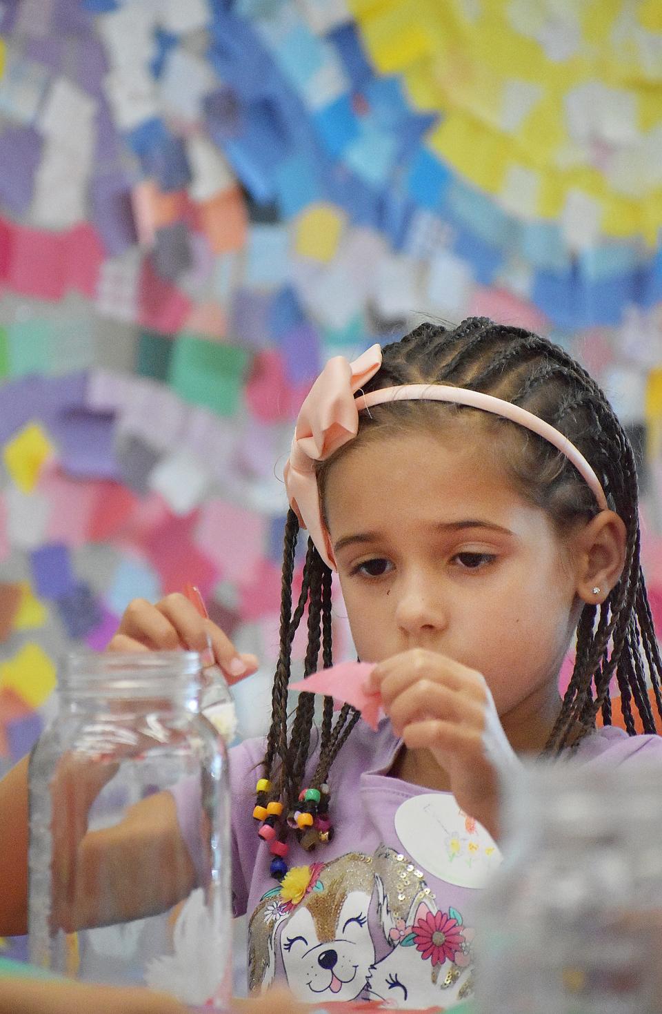 Evelyn works on a project at Art Pop.