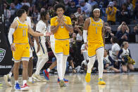 Kent State's Julius Rollins (0) reacts after committing a foul against Akron as teammates Giovanni Santiago (11) and VonCameron Davis (1) look on during the second half of an NCAA college basketball game in the championship of the Mid-American Conference tournament, Saturday, March 16, 2024, in Cleveland. (AP Photo/Phil Long)