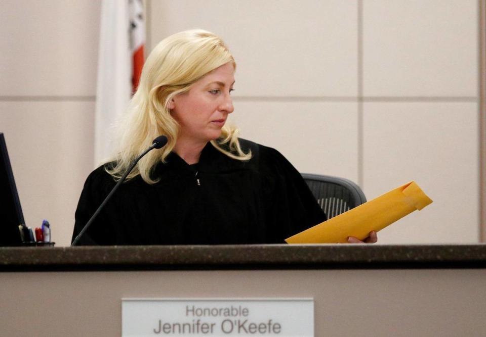 Monterey County Superior Court Judge Jennifer J. O’Keefe hands the verdict envelope to the courtroom clerk for safe keeping until the jury in the Paul Flores case reaches a verdict. (Laura Dickinson/The Tribune San Luis Obispo)