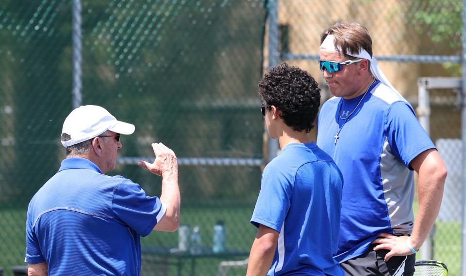 Central Christian's coach Gene Lehman has a few words with Adrian Lehman (center) and Drew Fisher (right) here at sectionals and has been more than happy with their play as they enter district action on Friday.