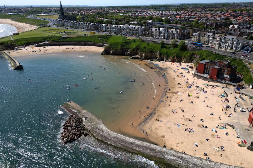 Paddle boarders enjoying the warm Spring Bank Holiday weather at Cullercoats