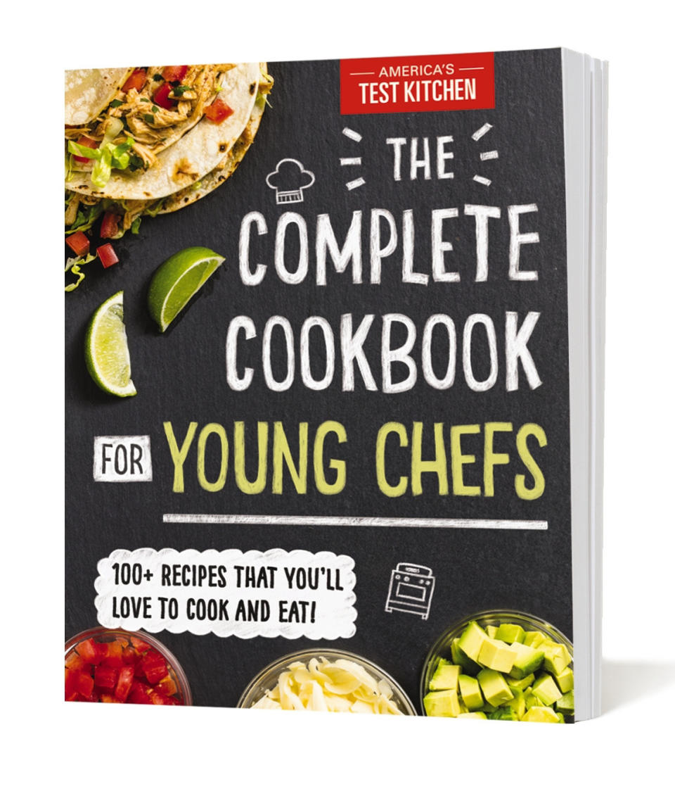 This image provided by America's Test Kitchen in February 2019 shows the cover for “The Complete Cookbook for Young Chefs.” It includes a recipe for Buttermilk Drop Biscuits. (America's Test Kitchen via AP)