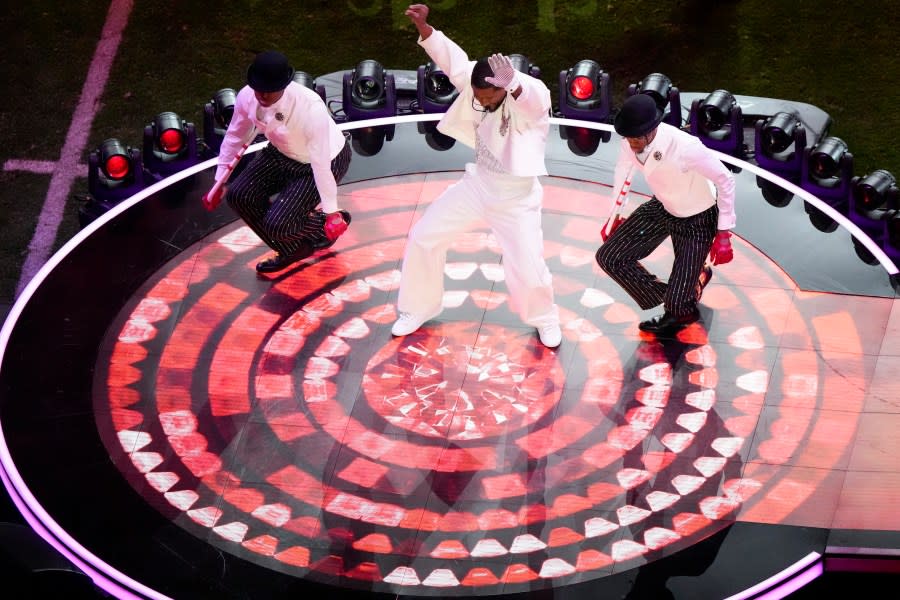 Usher, center, performs during halftime of the NFL Super Bowl 58 football game between the San Francisco 49ers and the Kansas City Chiefs Sunday, Feb. 11, 2024, in Las Vegas. (AP Photo/David J. Phillip)