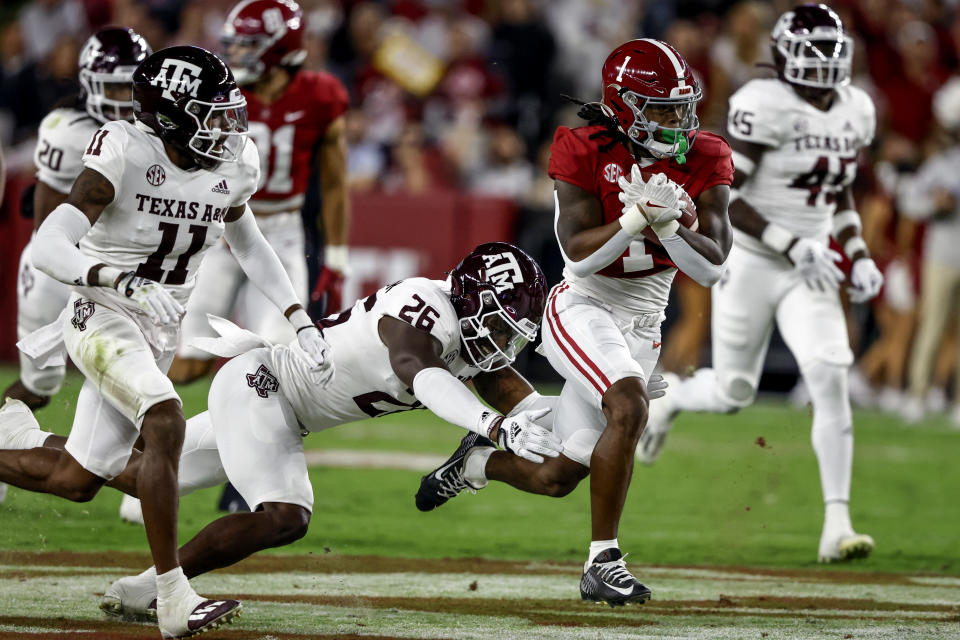 Oct 8, 2022; Tuscaloosa, Alabama; Alabama Crimson Tide running back Jahmyr Gibbs (1) carries the ball against Texas A&M Aggies defensive back Demani Richardson (26) during the first half at Bryant-Denny Stadium. Butch Dill-USA TODAY Sports