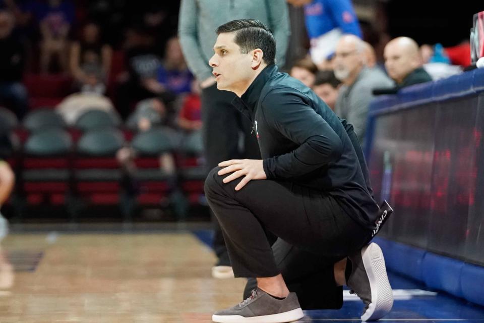 Mar 3, 2022; Dallas, Texas, USA; Cincinnati Bearcats head coach Wes Miller calls a play against the Southern Methodist Mustangs during the first half at Moody Coliseum.