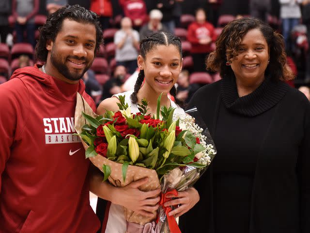 <p>Cody Glenn/Getty</p> Russell Wilson, Anna Wilson, and Tammy Wilson after the NCAA women's basketball game against the USC Trojans in 2020.