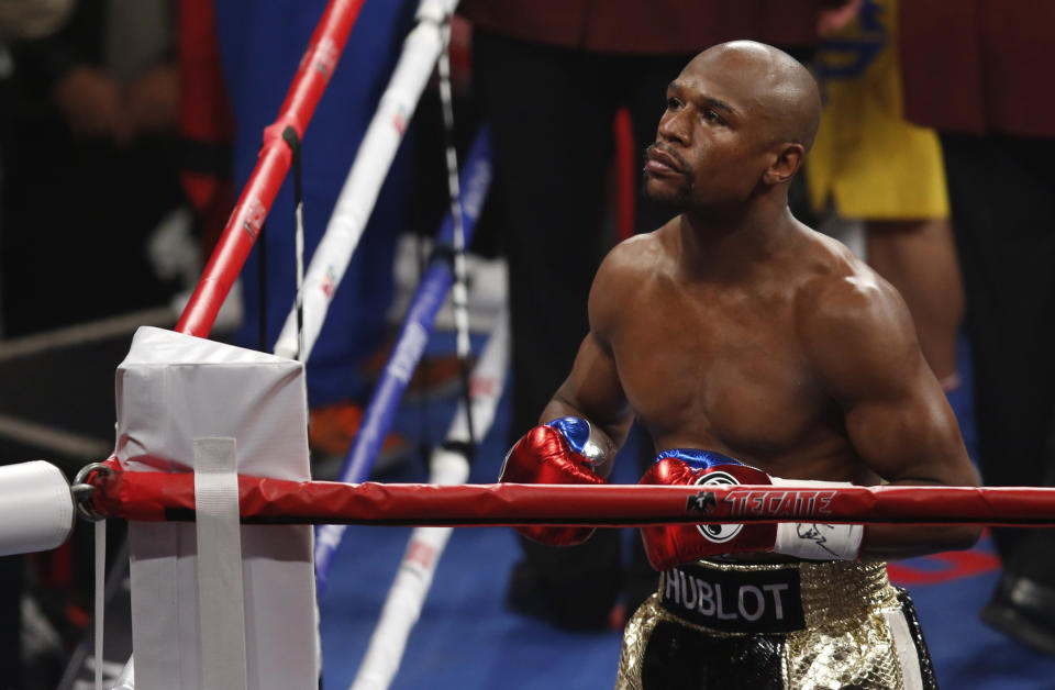 Floyd Mayweather Jr. enters the ring before his welterweight title fight against Manny Pacquiao, from the Philippines, on Saturday, May 2, 2015 in Las Vegas. (AP Photo/Eric Jamison)