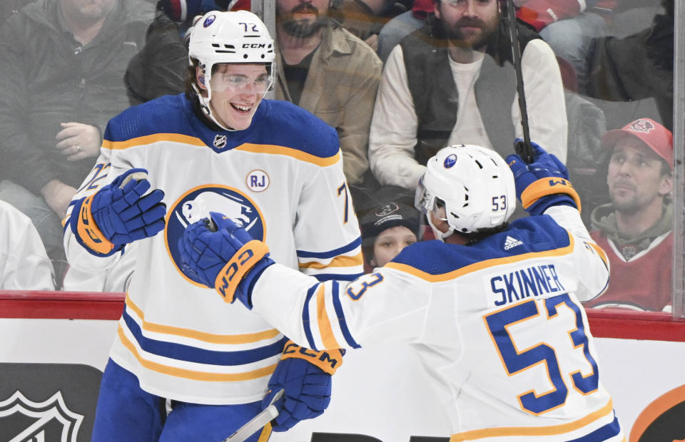 Buffalo Sabres' Tage Thompson (72) celebrates with Jeff Skinner (53) after scoring against the Montreal Canadiens during the third period of an NHL hockey game Thursday, Jan. 4, 2024, in Montreal. (Graham Hughes/The Canadian Press via AP)