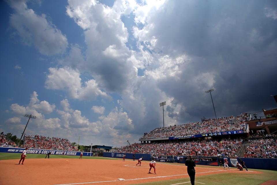 Clouds build during a softball game between the Oklahoma Sooners and Stanford in the Women's College World Series at USA Softball Hall of Fame Stadium in  in Oklahoma City, Monday, June, 5, 2023. 