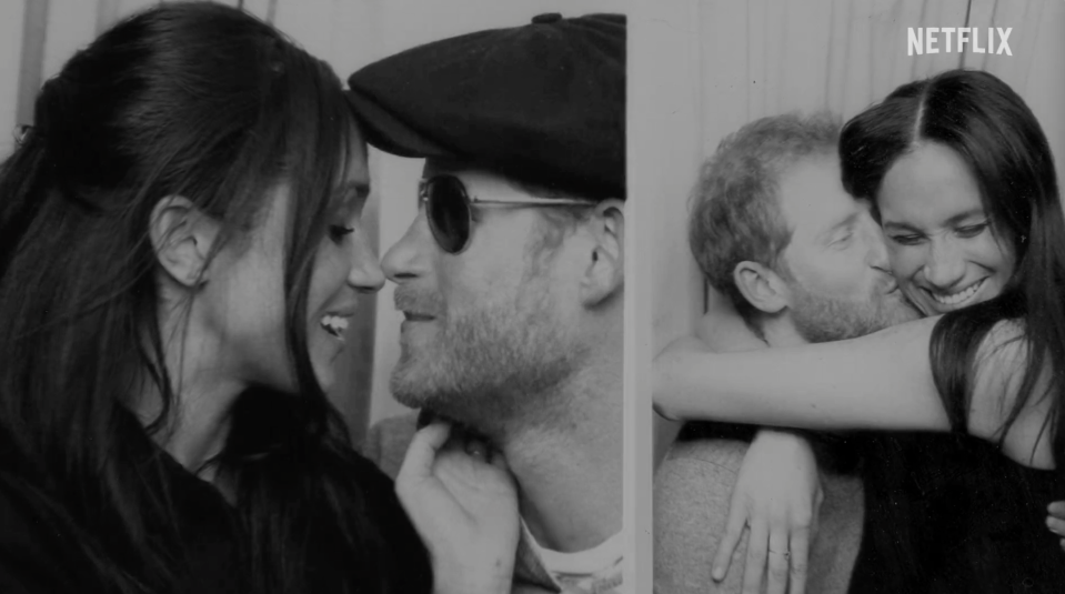 Harry and Meghan kiss in a photo booth.