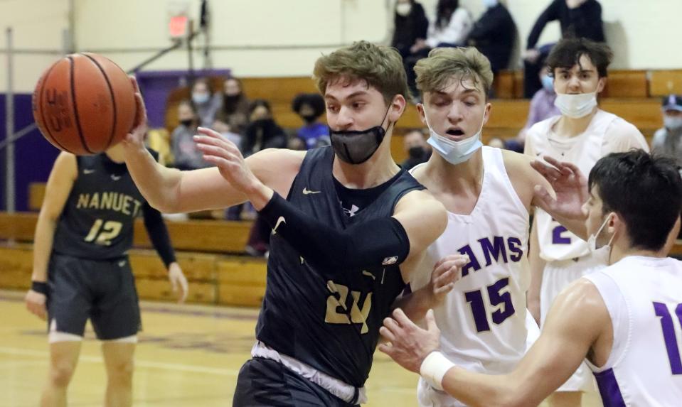 Nanuet's Nick Lanoce passes the ball during a game at Clarkstown North Jan. 26, 2022. Nanuet won 52-43.