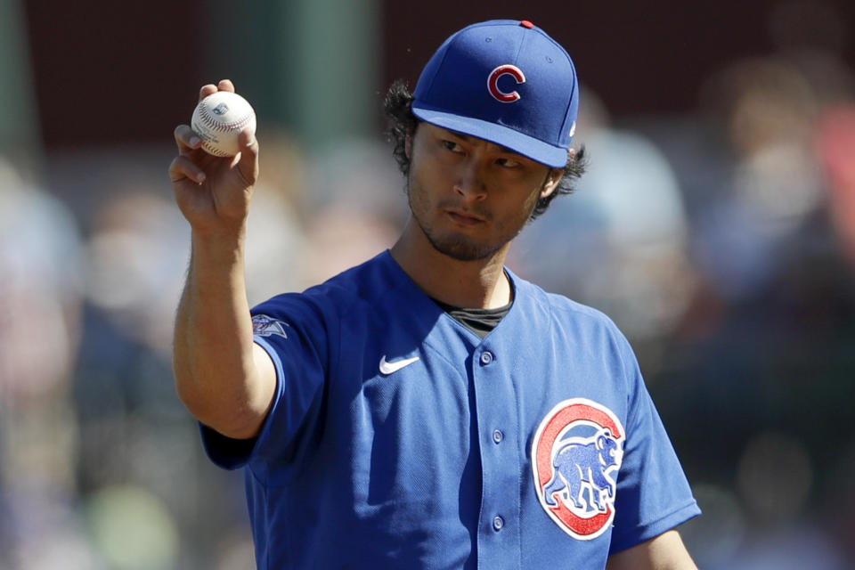 Chicago Cubs starting pitcher Yu Darvish motions as he works against a Milwaukee Brewers batter during the first inning of a spring training baseball game Saturday, Feb. 29, 2020, in Mesa, Ariz. (AP Photo/Gregory Bull)