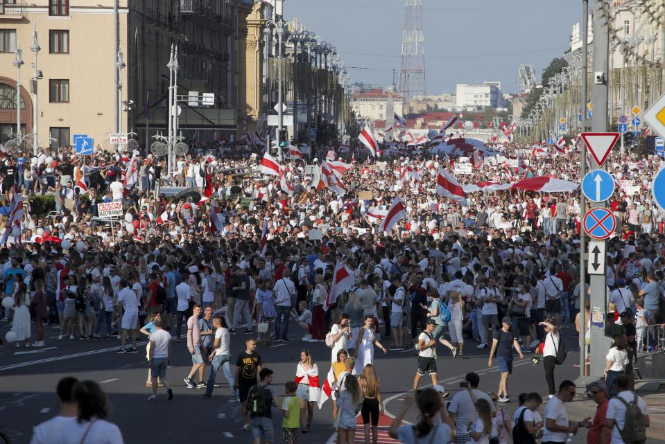 Belarusian opposition supporters rally in the center of Minsk, Belarus, Sunday, Aug. 16, 2020. Opposition supporters whose protests have convulsed the country for a week aim to hold a major march in the capital of Belarus. Protests began late on Aug. 9 at the closing of presidential elections. (AP Photo/Dmitri Lovetsky)