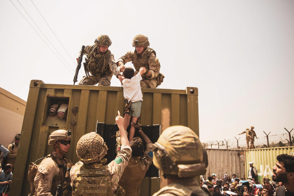 UK coalition forces, Turkish coalition forces, and U.S. Marines assist a child during an evacuation at Hamid Karzai International Airport, Kabul, Afghanistan, Aug. 20. U.S. service members are assisting the Department of State with a non-combatant evacuation operation (NEO) in Afghanistan. (U.S. Marine Corps photo by Staff Sgt. Victor Mancilla via Sipa USA) Please note: Fees charged by the agency are for the agency�s services only, and do not, nor are they intended to, convey to the user any ownership of Copyright or License in the material. The agency does not claim any ownership including but not limited to Copyright or License in the attached material. By publishing this material you expressly agree to indemnify and to hold the agency and its directors, shareholders and employees harmless from any loss, claims, damages, demands, expenses (including legal fees), or any causes of action or allegation against the agency arising out of or connected in any way with publication of the material.