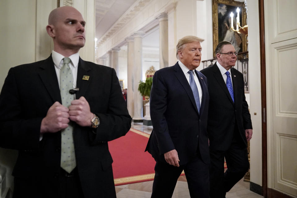 A Secret Service agent with Donald Trump and Jack Keane 