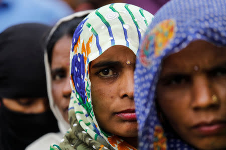 Voters line up to cast their votes outside a polling station during the second phase of general election in Amroha, in the northern Indian state of Uttar Pradesh, India, April 18, 2019. REUTERS/Anushree Fadnavis