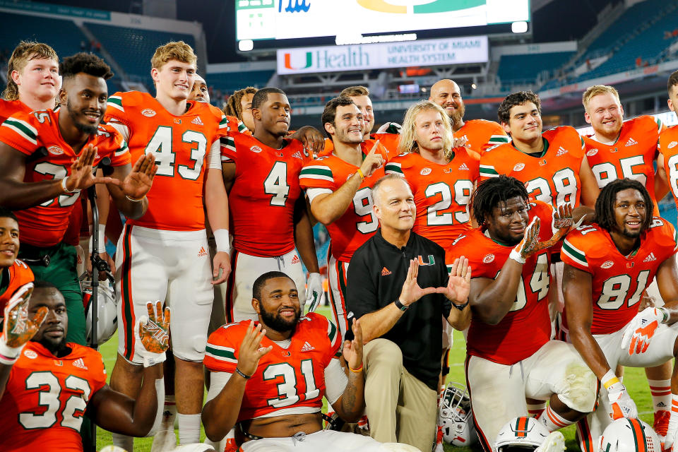 MIAMI GARDENS, FL - NOVEMBER 24:  The Miami Hurricanes seniors pose for a photo with head coach Mark Richt after the game against the Pittsburgh Panthers at Hard Rock Stadium on November 24, 2018 in Miami Gardens, Florida.  (Photo by Michael Reaves/Getty Images)