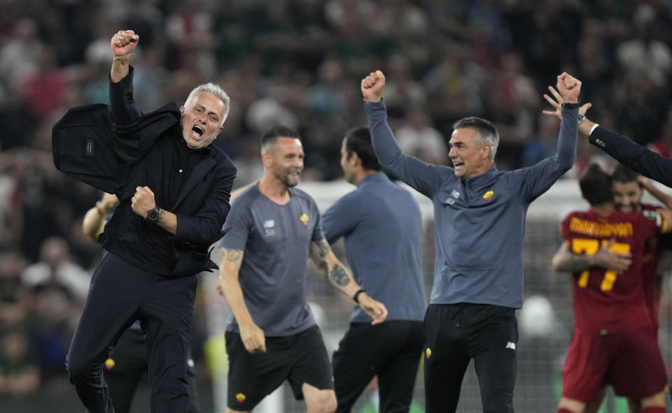 FILE - Roma's Jose Mourinho, left, celebrates their victory during the Europa Conference League final between AS Roma and Feyenoord at National Arena in Tirana, Albania, Wednesday, May 25, 2022. Roma has announced on Tuesday, Jan. 16, 2024 that José Mourinho is leaving the club “with immediate effect.” The Portuguese coach led the Giallorossi to the UEFA Conference League title in his first season. (AP Photo/Antonio Calanni, File)