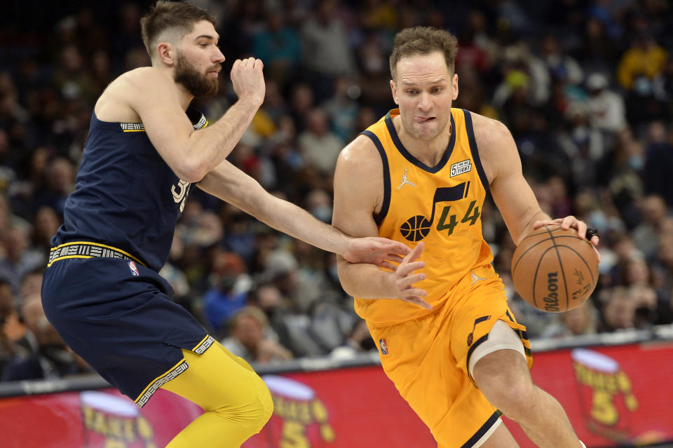 Utah Jazz forward Bojan Bogdanovic (44) handles the ball against Memphis Grizzlies forward Killian Tillie in the second half of an NBA basketball game Friday, Jan. 28, 2022, in Memphis, Tenn. (AP Photo/Brandon Dill)