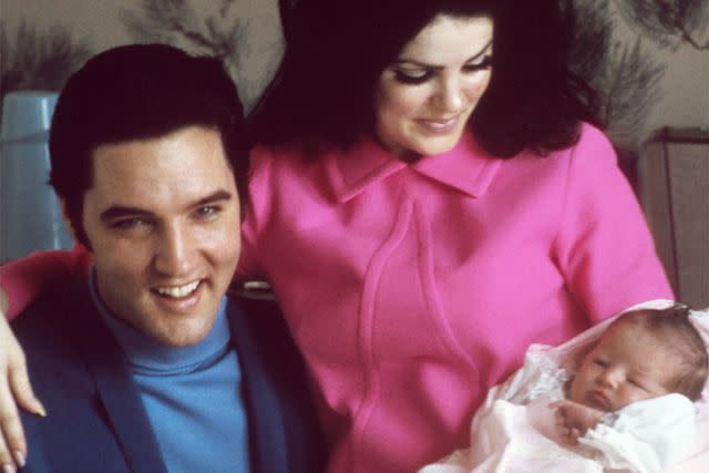 Michael Ochs Archives/Getty Lisa Marie Presley with her parents Elvis and Priscilla in 1968.