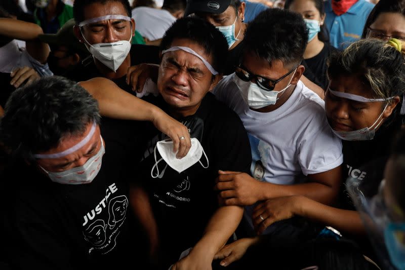 Family buries Filipino mother and son shot by police over noise