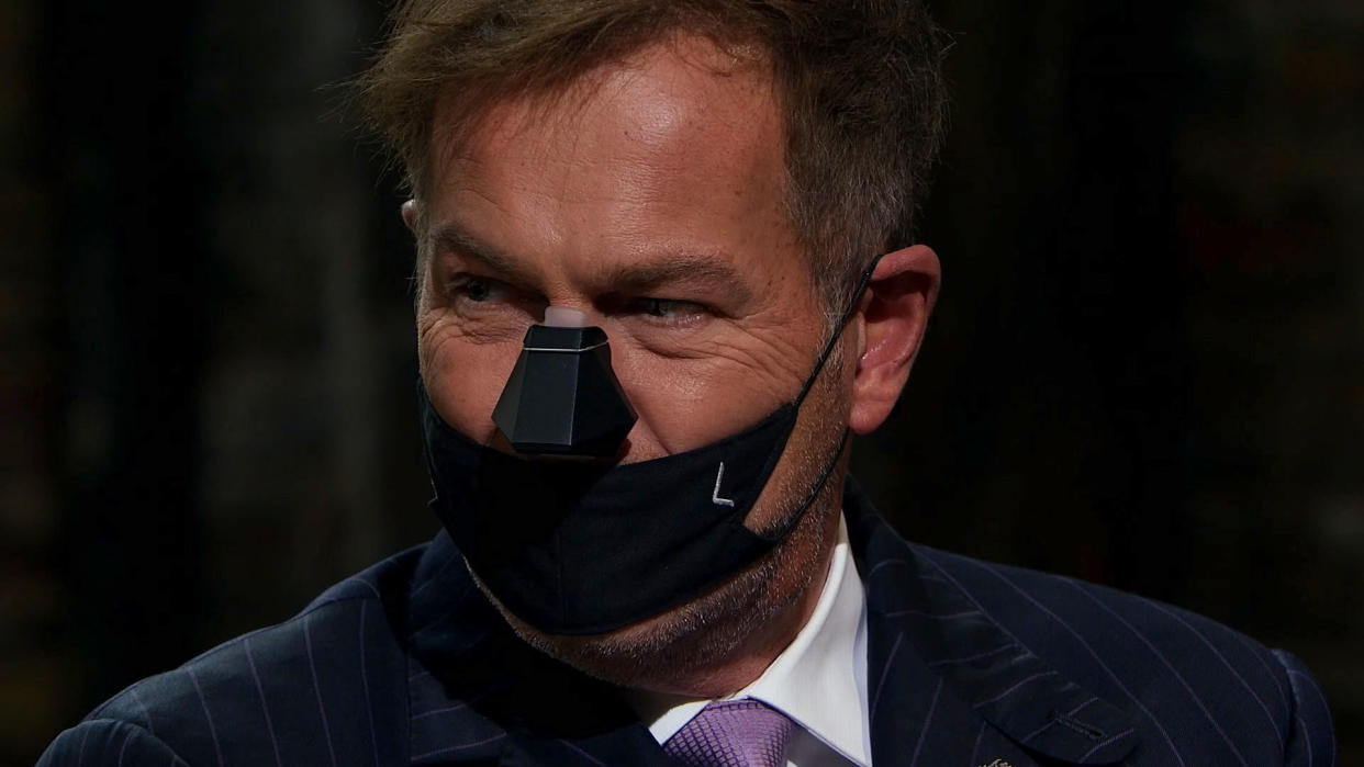 Peter Jones tries on the Nosy device. (BBC)